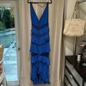 Intricate beading and slit at front, deep V at back